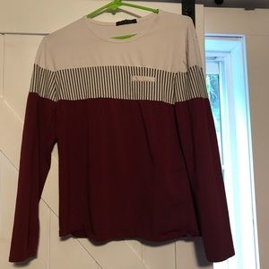 Long sleeve burgundy shirt.